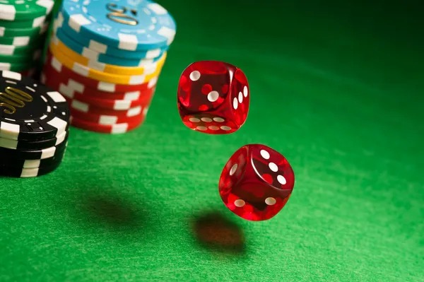 Professional live dealer at a blackjack table in a studio